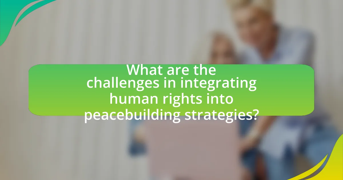 What are the challenges in integrating human rights into peacebuilding strategies?